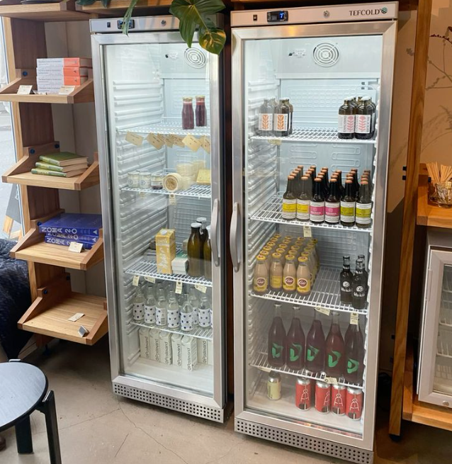 Chilled retail fridge with beverages in a cafe or workplace setting