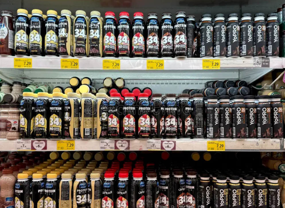 Crowded protein RTD shelf with many competing bottles